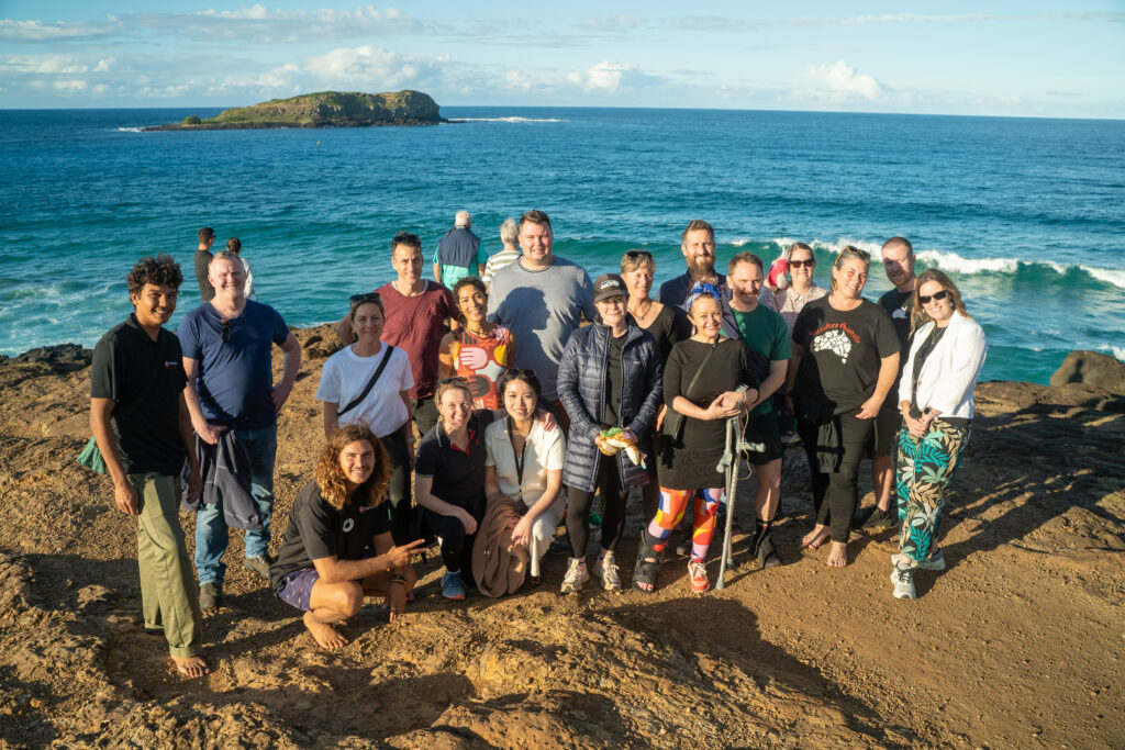 banaam alliance on country cultural experience with group on gold coast ocean near fingal heads